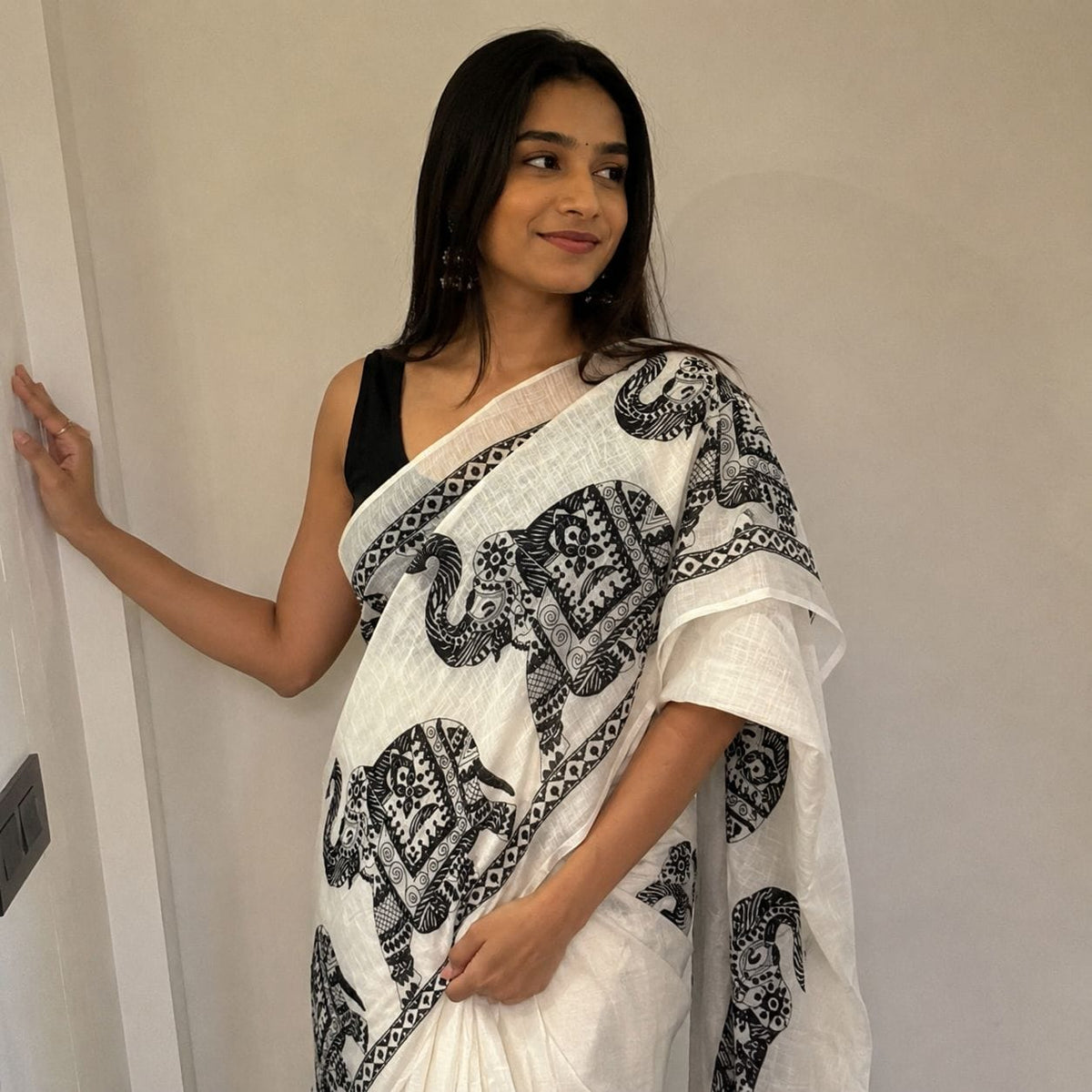 white and black elephant motif saree