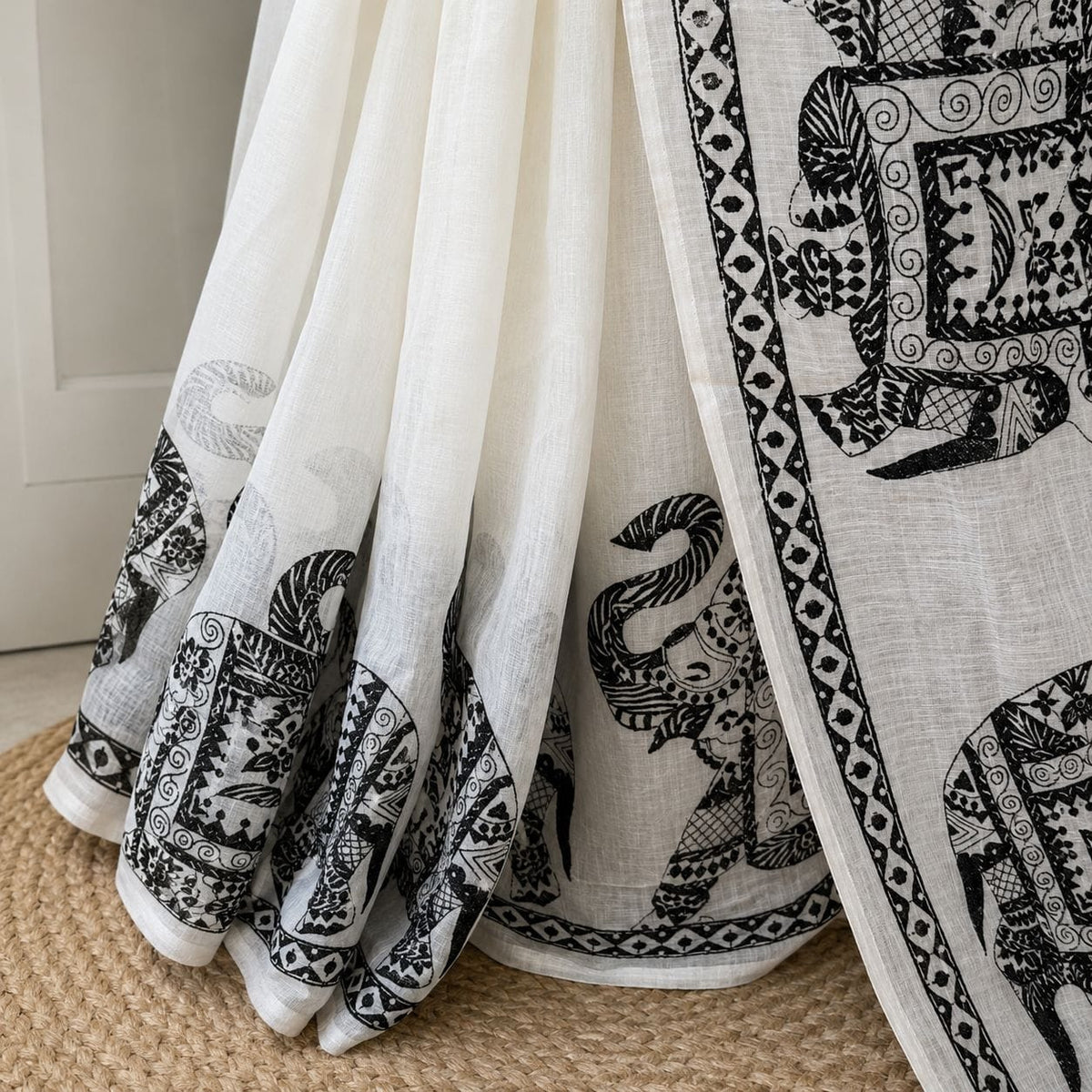 white and black elephant motif saree