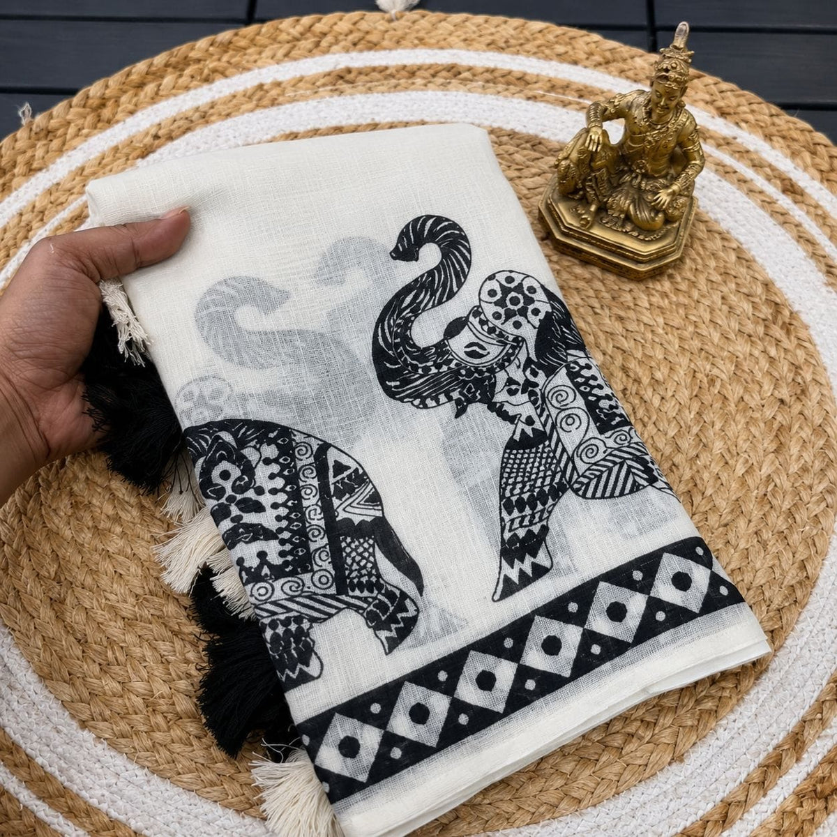 white and black elephant motif saree