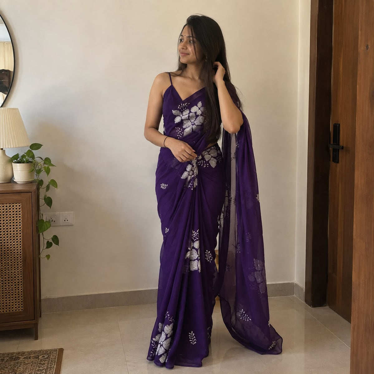 Purple soft silk saree with floral sequin embellishment – full drape view on model