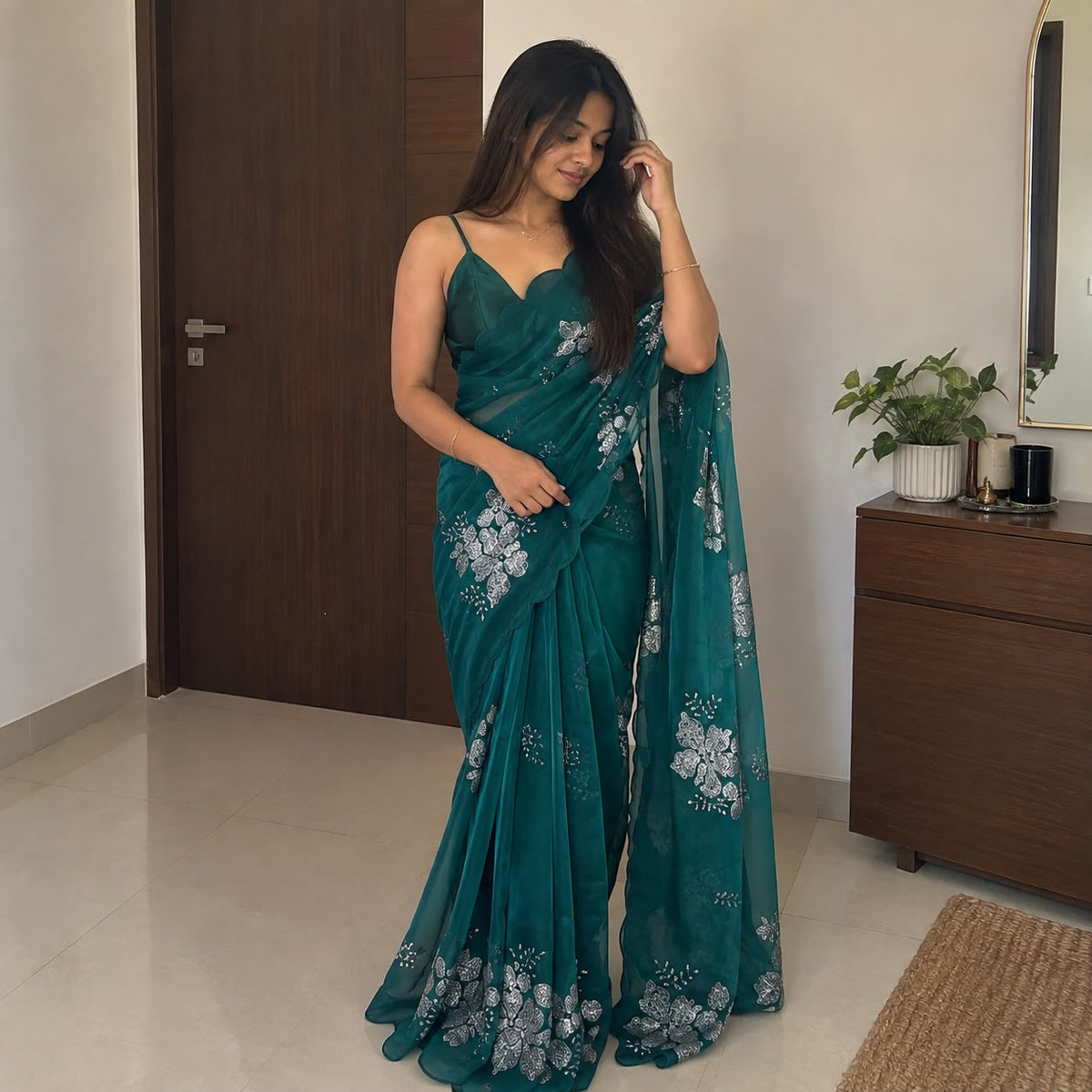 Green soft silk saree with floral sequin embellishment – full drape view on model