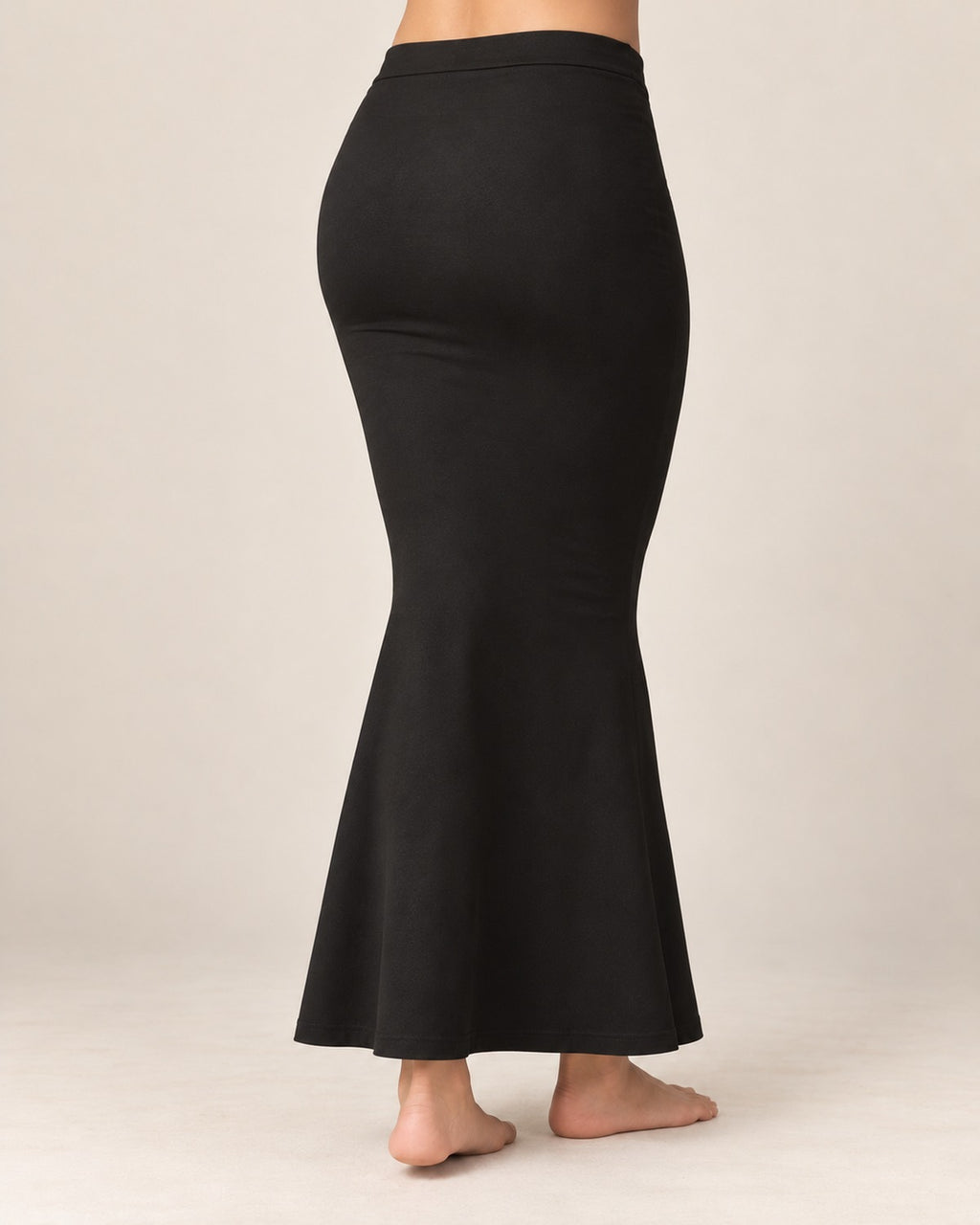 Back view of the black fish-cut saree shapewear petticoat showing the seamless finish