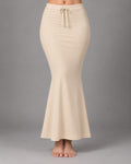 Cream fish-cut saree shapewear petticoat worn on a model against a soft grey background