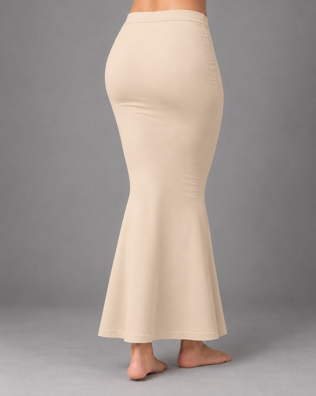 Back view of the cream fish-cut saree shapewear petticoat showing the seamless finish