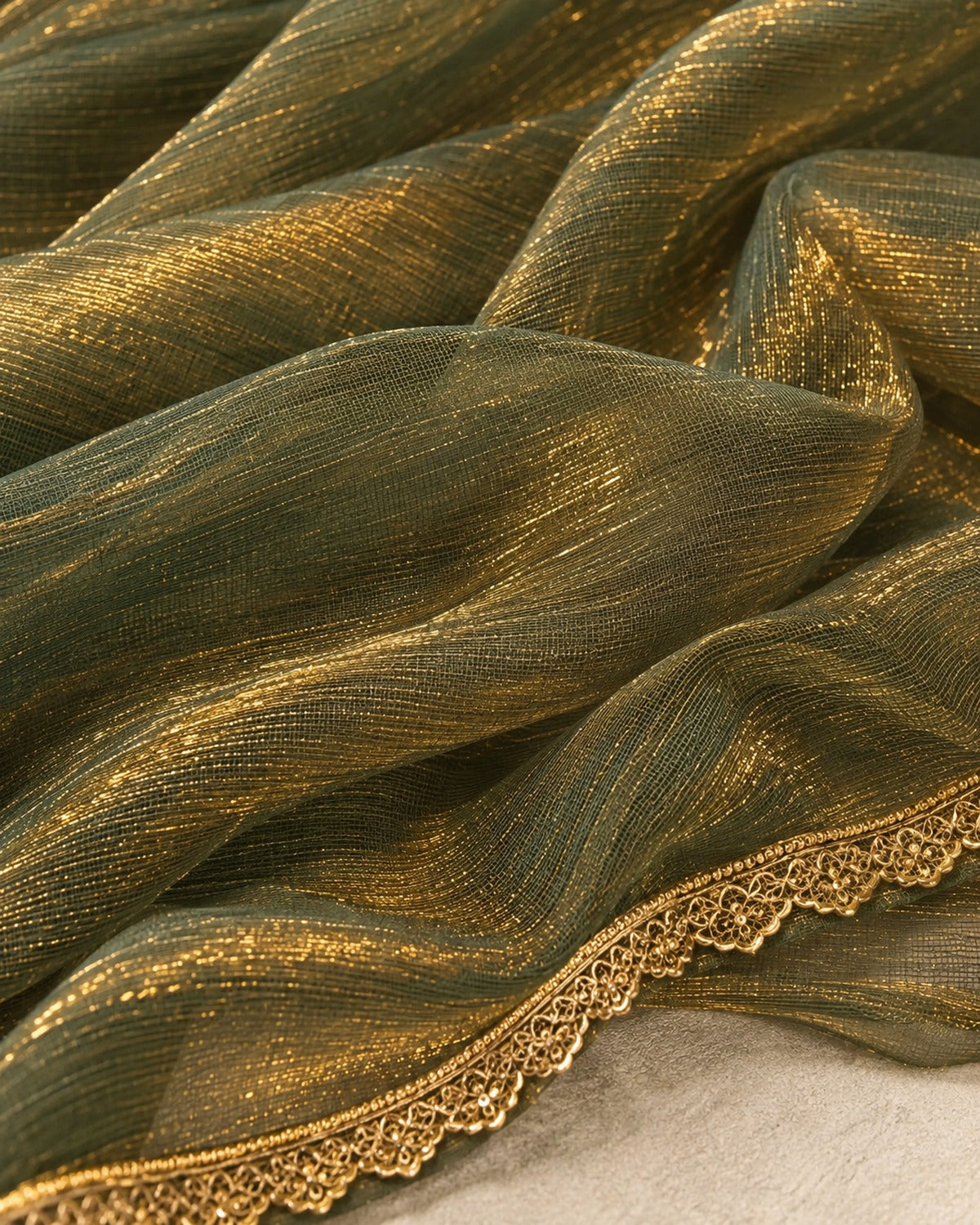 Close detail of the olive green shimmer net weave and its gold embellished border