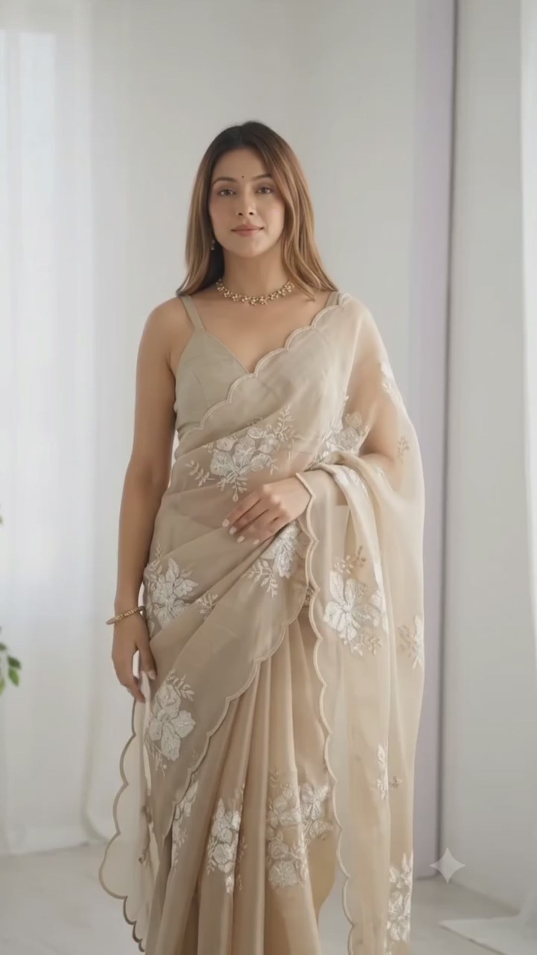 Beige sequin silk saree in movement