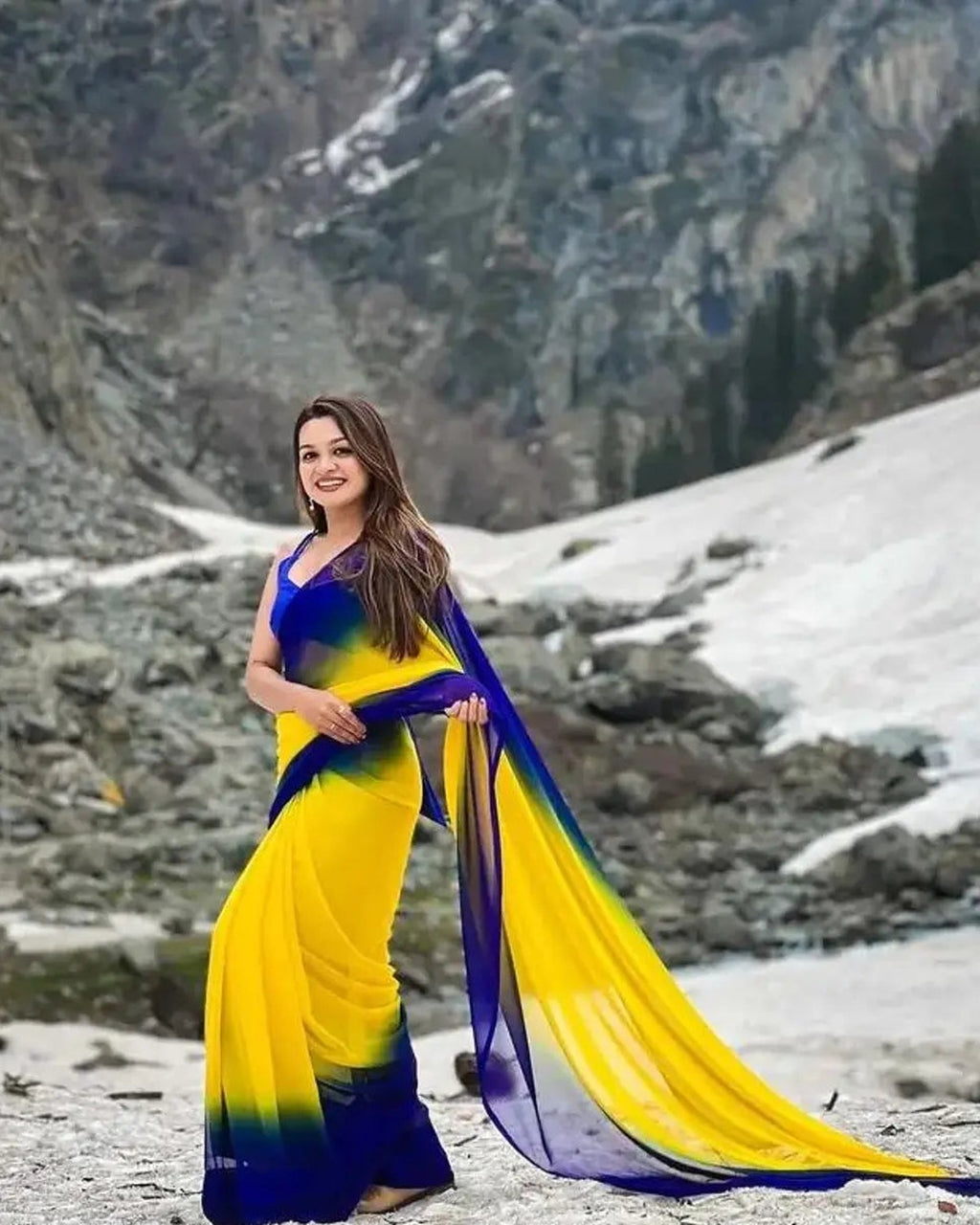 Royal blue and yellow two-tone georgette saree draped on model