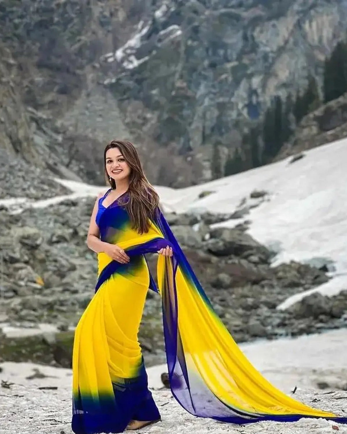 Royal blue and yellow two-tone georgette saree draped on model