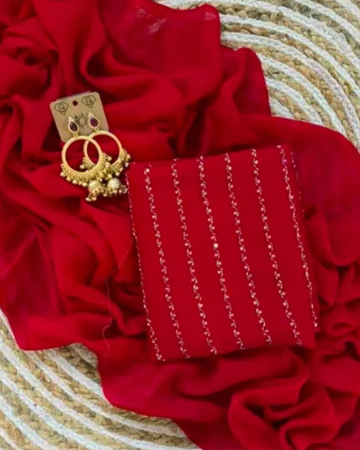 Red crush saree blouse piece showing the zari stripe work