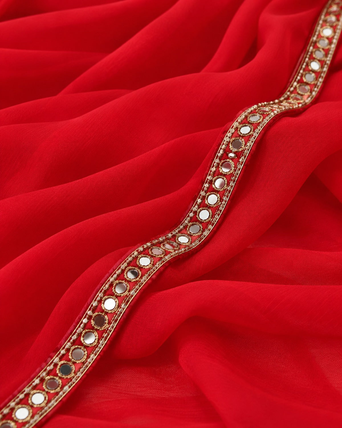 Close detail of the red georgette and its mirror work lace border