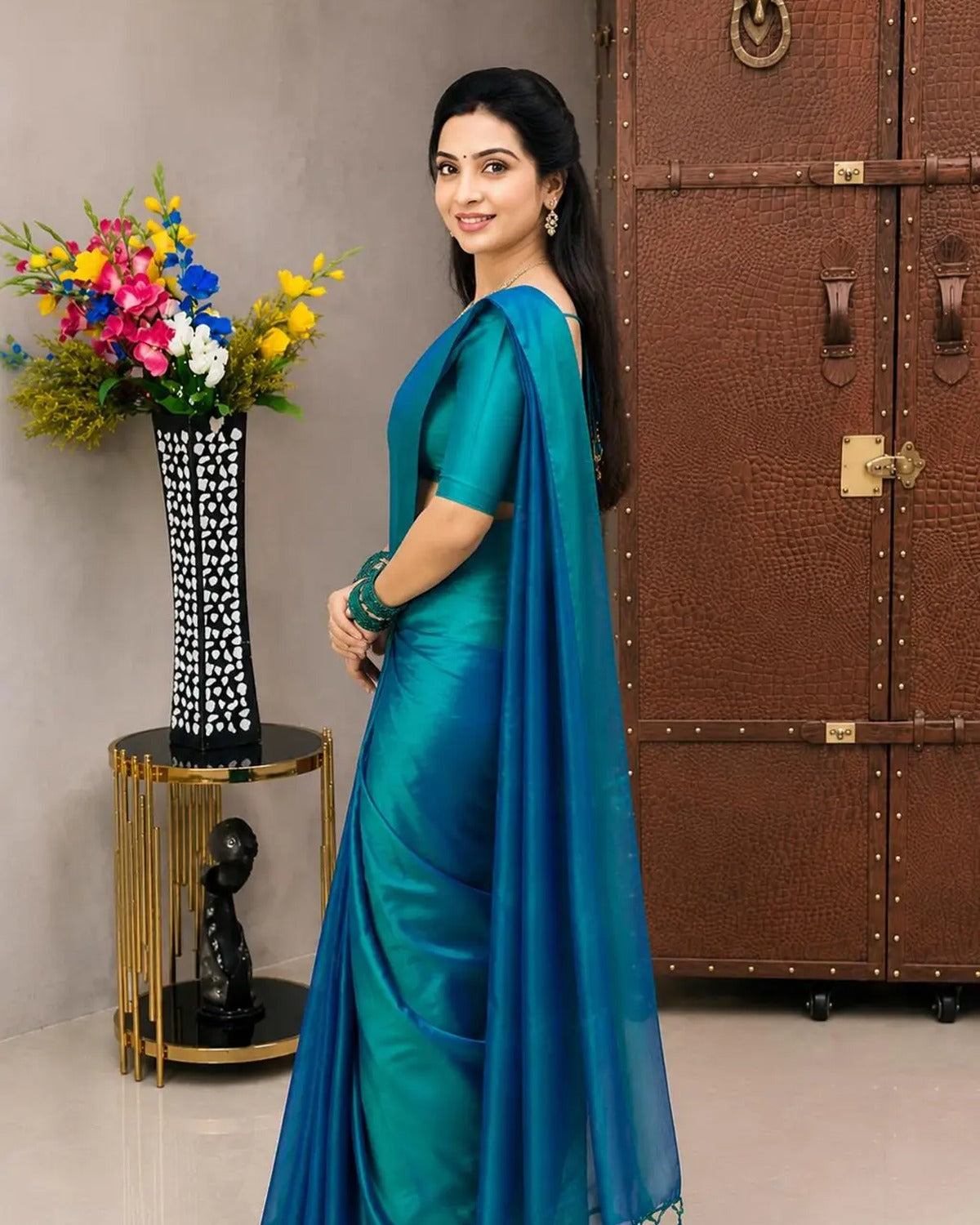 Side view showing the teal to blue gradient down the drape