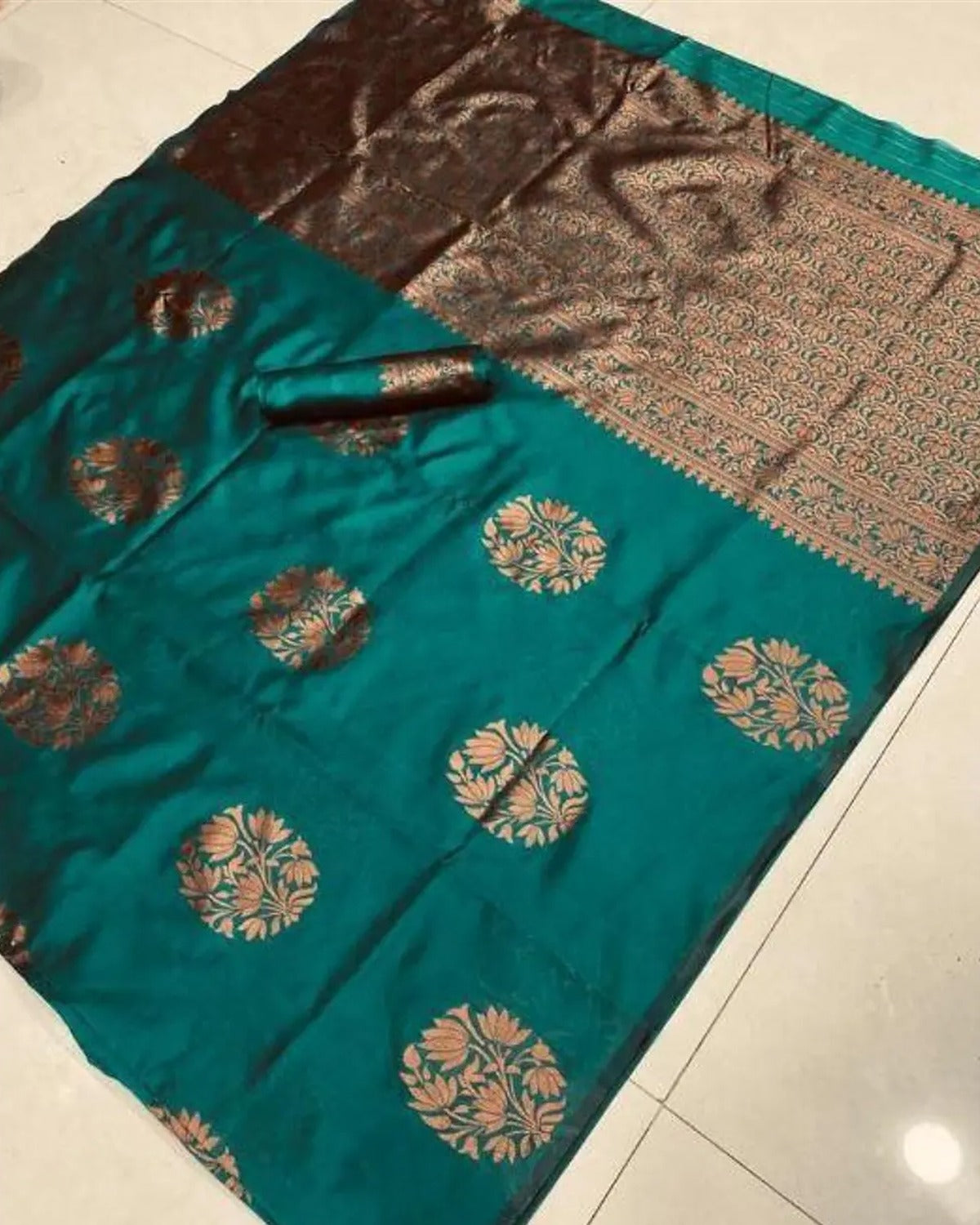 Green Banarasi silk saree with copper floral zari motifs and woven pallu